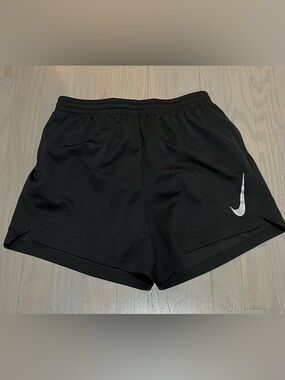 NWOT. Nike Boys DRI-FIT Black  Athletic Shorts with brief lining and pockets.
